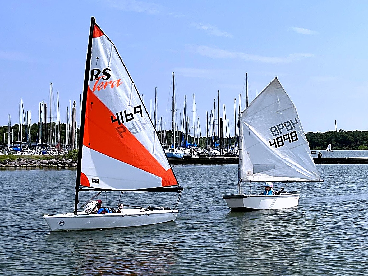 Two young sailors in RS Tera and Optimist dinghies