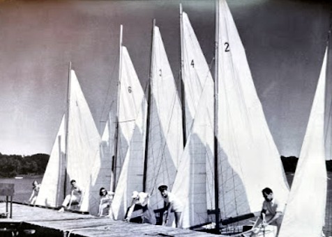 DCYC sailboats lined up along the dock, founding era